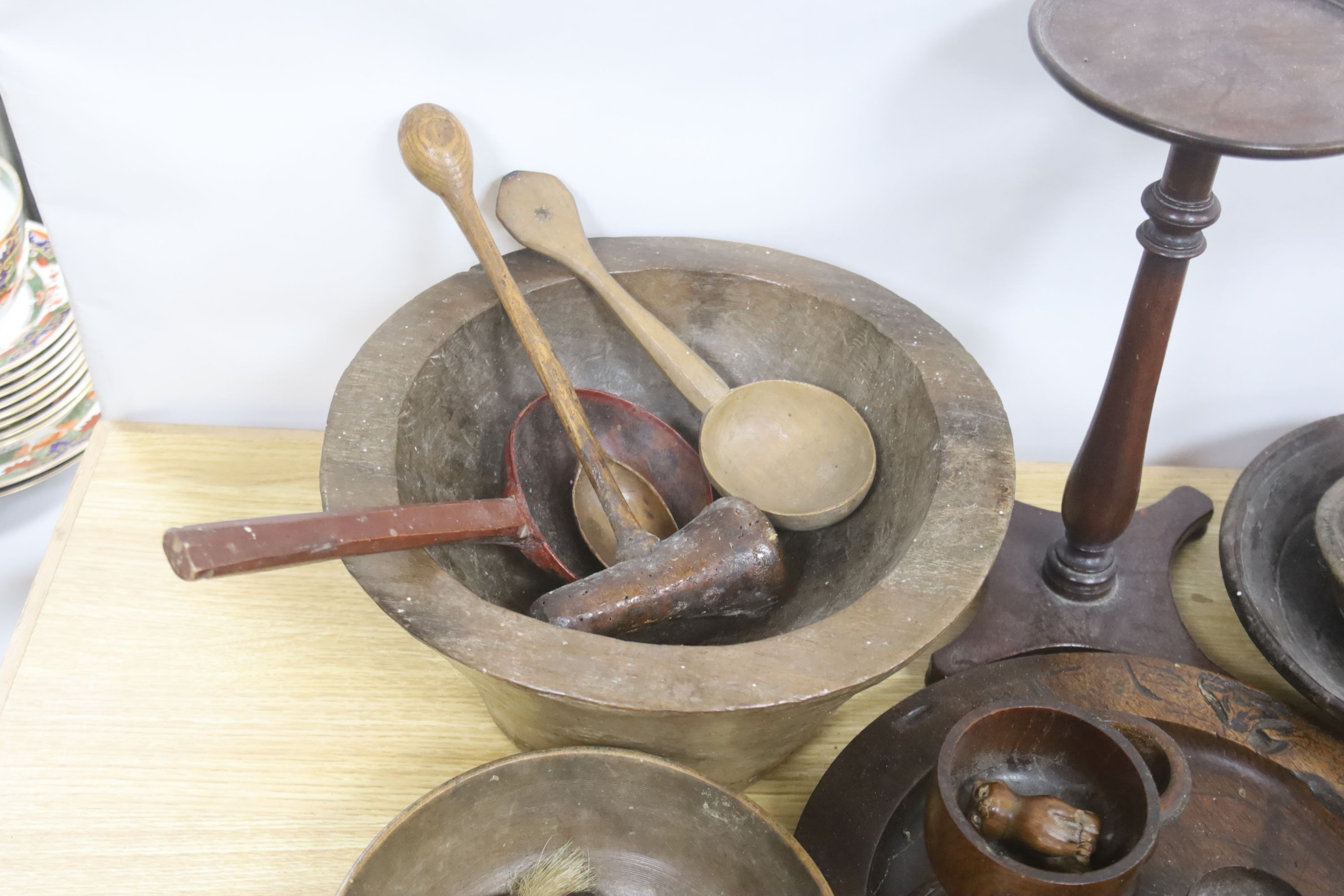 A group of assorted treen including an 18th century sliding lid mahogany box, a candle stand and various goblets etc.